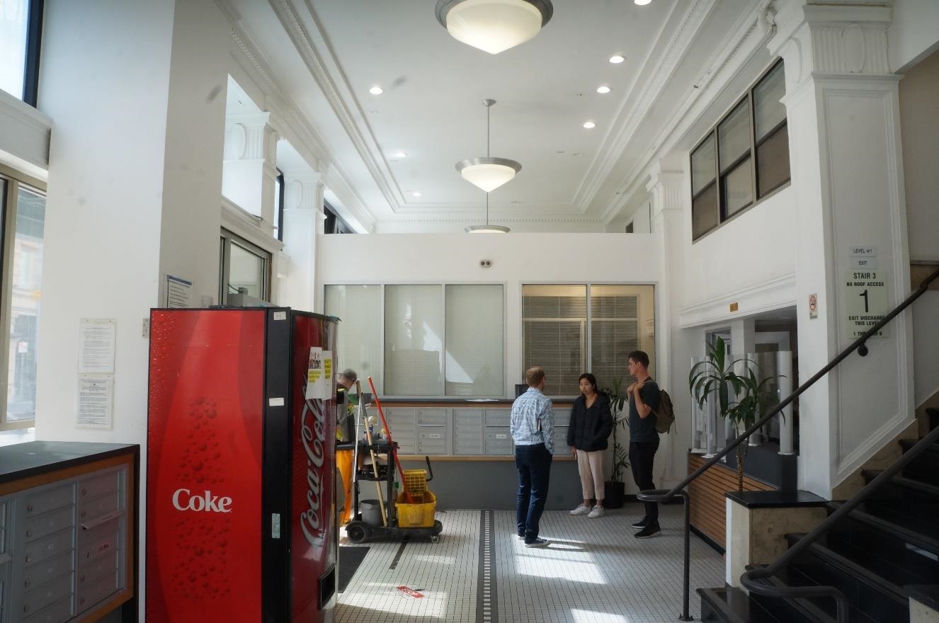 Lobby with newly enclosed front desk and added mailboxes